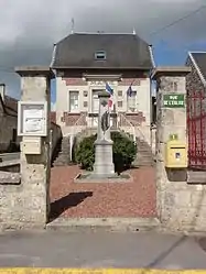 The town hall and monument to the dead of Suzy