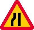 Road narrows on left sides