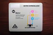 The new "switchable" FasTrak transponder used in the Metro ExpressLanes; the driver indicates the number of occupants in the vehicle using the switch, which the toll system detects and automatically computes the toll (or lack of a toll) for.