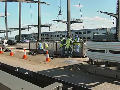 Maintenance crew painting the bridge