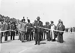 Image 7Ribbon ceremony to open the Sydney Harbour Bridge on 20 March 1932. Breaking protocol, the soon to be dismissed Premier Jack Lang cuts the ribbon while Governor Philip Game looks on. (from History of New South Wales)