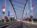 The flags of the city of Szeged, the Republic of Hungary, and the European Union decorate the bridge during national holidays