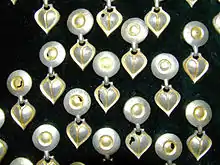 Dozens of small gilded silver objects