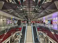 Symmetrical view of the TEL station with stainless steel panels on the roof