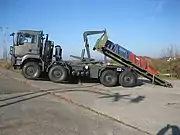 A TG MIL TGS (8x8) with hooklift-type load handling system.