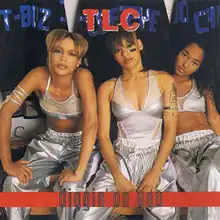 The three band members are seated while dressed in matching silver outfits from left to right; T-Boz, Left Eye, and Chilli.