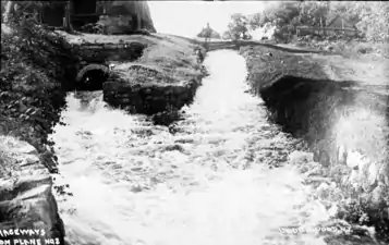 Tailrace of Plane 2 East. Water from the turbine comes out from the left. Water on the right is from the bypass flume.