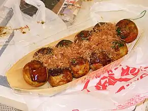 Takoyaki is a ball-shaped Japanese snack made of a wheat flour-based batter and typically filled with minced or diced octopus.