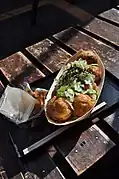 Takoyaki served with grated daikon and tsuyu