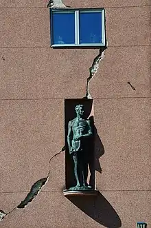 A sculpture on the wall of the Art house.