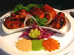 Image 47Chicken tikka, a well-known dish across the globe, reflects the South Asian cooking style.  (from Culture of Asia)