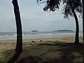 Tanjung Aru beach. Pulau Sulug can be seen on the left and Pulau Manukan on the right of the horizon.