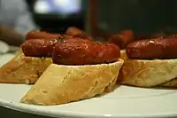 A tapa of fried chistorra on toast