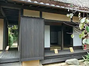 Left, an en running between buildings, joining them.