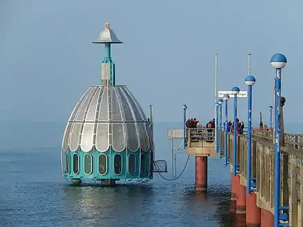 Submarining dive gondola at a pier in Zingst