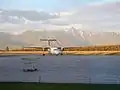 An Air Canada Express Dash 8-Q300 taxiing up to the terminal