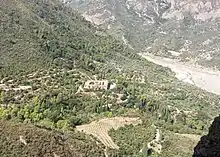 Greek Orthodox monastery of the Holy Archangels (Pammegiston Taxiarchon), Aigialeia, Greece. View from the rock of the hermitage of Saint Leontius. Inside the church of the monastery the Honorable Body of Saint Leontius is kept.