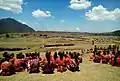 The closing of the Tebe dance is marked by sitting cross-legged