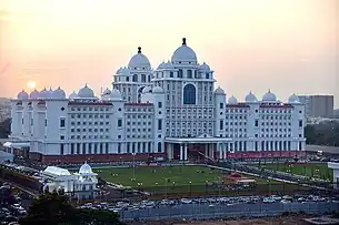 Telangana State Secretariat front view with orange sky in the background