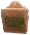 This tzedakah box hung for decades in Temple Sinai, in New Orleans, calling on congregants to support social justice causes.