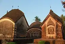 Baranagar: It has several temples built by Rani Bhabani. Of these, Char Bangla Temples (partially shown in the picture) and Bhavaniswar Mandir are ASI Listed Monuments.