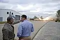 NASA Administrator Charles Bolden (left) and John C. Stennis Space Center Director Patrick Scheuermann view a test firing of the first Aerojet AJ26 flight engine.