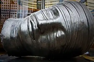 Testa Addormentata, bronze, 1983, located at Bank Street, Outside West Wintergarden, Canary Wharf, London, Great Britain