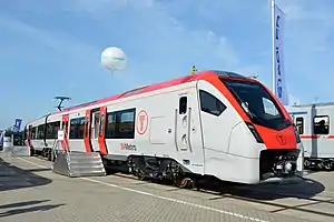 White and red train on display