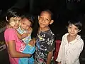 Market children with thanaka, Mandalay