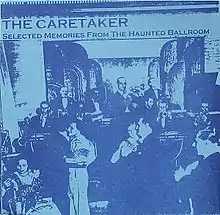 An old, washed-out photo of an early 20th century ballroom.