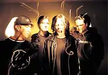 Four band members from a 1997 photo shoot