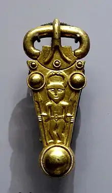 Finglesham buckle, showing the naked pagan God Woden with spears, horned helmet, belt buckle.