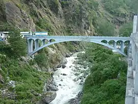 The Sino-Nepal Friendship Bridge with Nepal on the left, and China on the right side of the Sun Kosi River.