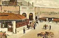 Old postcard of the Public Market outside Grand Casemates Gates as viewed from West Place of Arms.