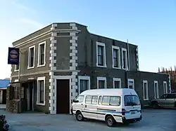 The Highwayman Hotel at Dunback, built from local schist and limestone in 1864.