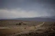 The Great Wall near Jiayu Pass, Qilian Mountains in behind