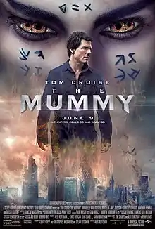 The poster features skyscrapers stuck in a blizzard, in the center. Upon which Tom Cruise appears, whose face is looking somewhere else. Behind him, face of Egyptian Princess appears, spread upon whole top-half portion. The princess has two irishses in each eye, which appears like she got four eyes. Above all these, in the center, title: THE MUMMY, appears.