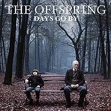 The album cover depicts a child sitting on a bench in a forest on the right side looking up alongside a man (which could possibly be the child in the future) on the left side. The words "The Offspring" and "Days Go By" are on the top and are in capital letters.
