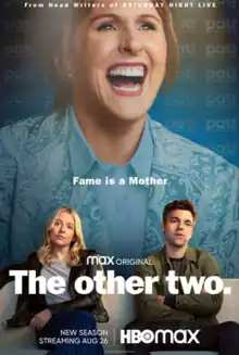 The poster shows lead characters Brooke and Cary sitting on a white couch in front of a wall-size portrait of their mother's face. The tagline "fame is a mother" is printed above their heads.