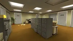 A brightly lit office space with tarnish-brown flooring, egg-white walls, and square overhead lights. Several closed doors leading to personal offices and other rooms line the walls, as well as plants and other office-related objects. In the center of the room is a large filing cabinet.