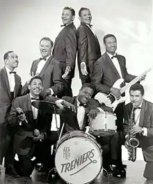 Late 1950sClockwise from left: Gene Gilbeaux (piano), Buddy Trenier, Cliff Trenier, Claude Trenier, Jimmy Johnson (bass), Don Hill (sax), Henry (Tucker) Green (drums), Skip Trenier