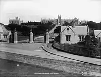 The former formal entrance to The University of Sydney, flanked by the Gardener's Lodge (extant) and the Messenger's Lodge (demolished 1940), now the eastern end of Victoria Park at the corner of City Road and Parramatta Road