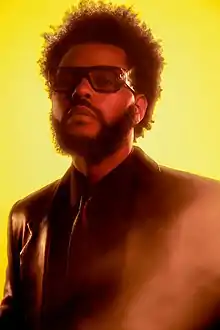 Canadian singer The Weeknd was the first artist of the decade to achieve a Billboard number-one single of the year (for the year 2020) with his hit single "Blinding Lights", which was also performed during the Super Bowl LV in 2021.