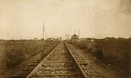 Looking down the track towards some buildings