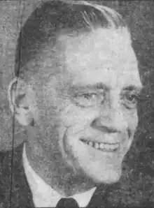 Black and white photo of Fitzgerald in a suit and tie