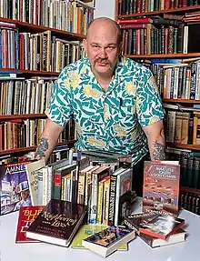 Disch with his books in 1988