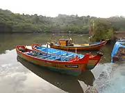 Big fishing boats tied to the old stone anchors