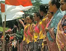 Image 4Timorese women with the Indonesian national flag (from History of Indonesia)