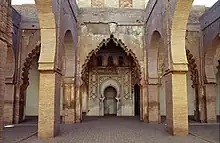 View of the prayer hall, looking towards the mihrab (center). The southermost aisle, before the mihrab, is demarcated by different arch designs.