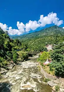 Khundan bridge across river Tirthan